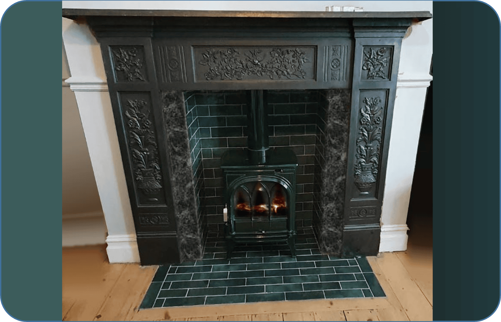 Black surround with green tiled hearth and chamber